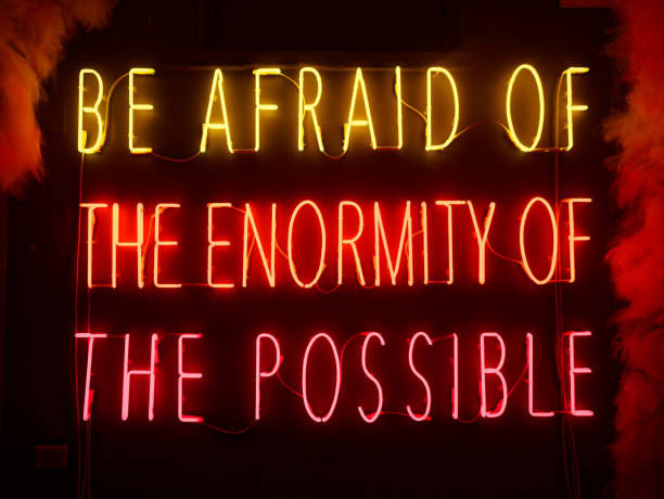 istock Be afraid of the enormity of the possible neon text written colored 2083676090