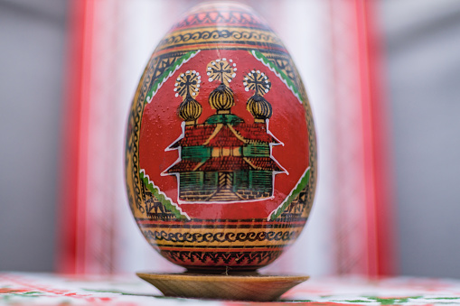 Easter still life with a souvenir painted egg for the background