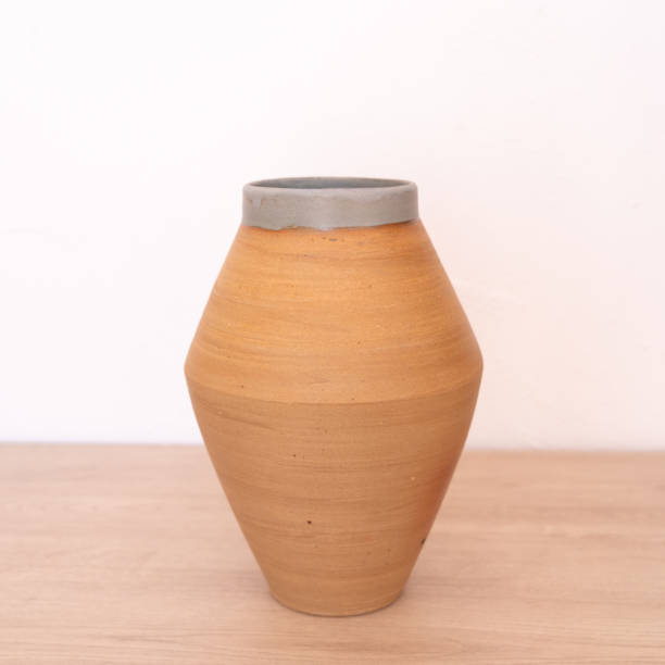 istock Handmade thrown flower vase on wooden counter 2083753970
