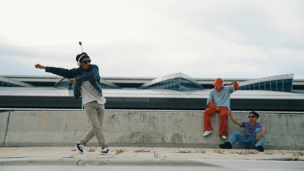istock Break dancer enjoy perform freestyle movement with friend cheering. Sprightly. 2083788239