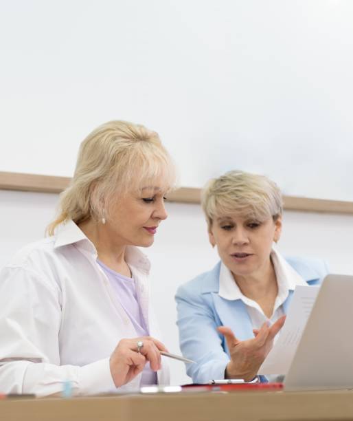 istock Two businesswomen in a meeting discussing a project while looking at a laptop. 2083795548