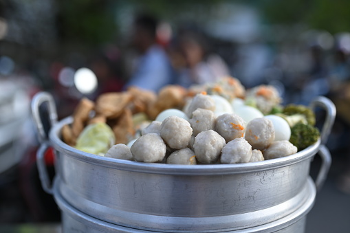 Siomay (also Somai) is an Indonesian steamed fish dumpling with vegetables served in peanut sauce