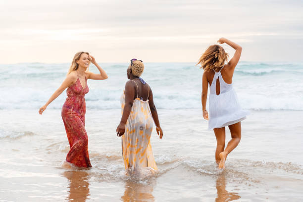 istock young women enjoying the beach 2083796094