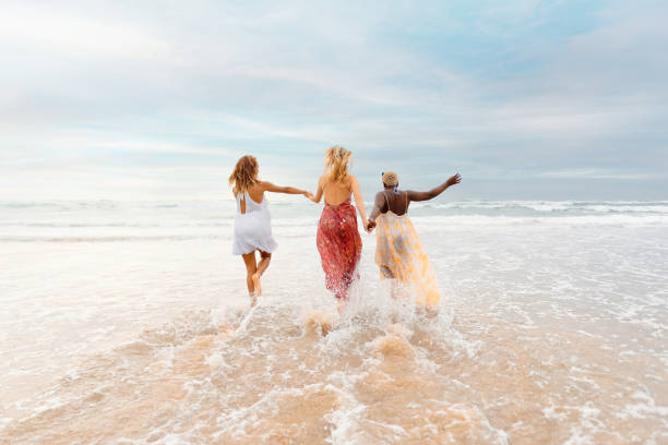 istock young women enjoying the beach 2083796238