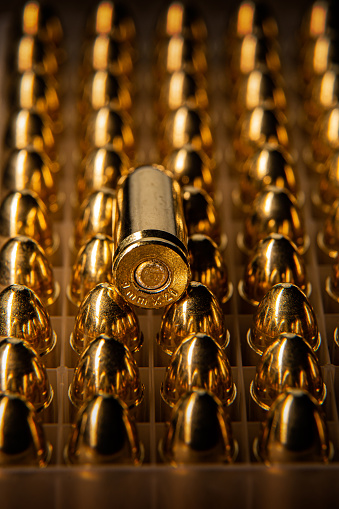 Pistol cartridges 9 mm. Ammunition for pistols and PCC carbines on a dark background.