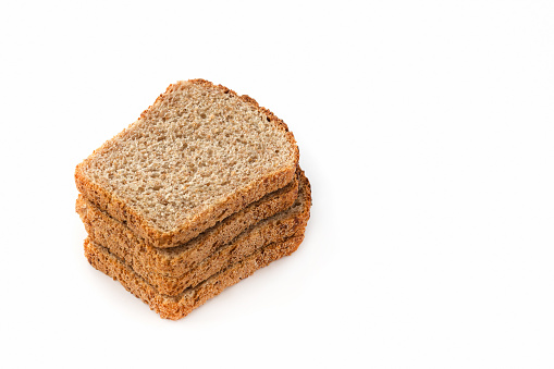 Slices of grain bread on a white isolated background. Healthy eating concept.