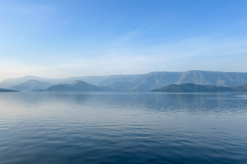 Beautiful shape of hill at Lake Toba, Samosir, with blue sky at background