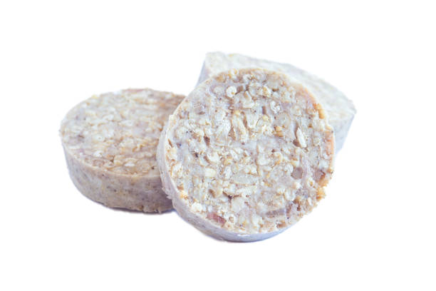 istock Irish and British white or oatmeal pudding sausage, isolated on white 2083858392