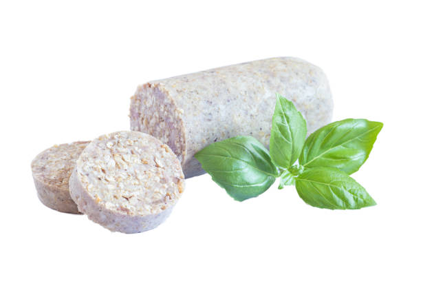 istock Irish and British white or oatmeal pudding sausage with basil leaf, isolated on white 2083860000