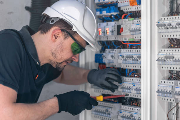 istock A male electrician works in a switchboard using an electrical connection cable. 2083862194