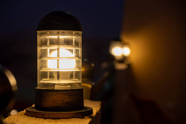Yellow Led lights on house wall with dark shades during night