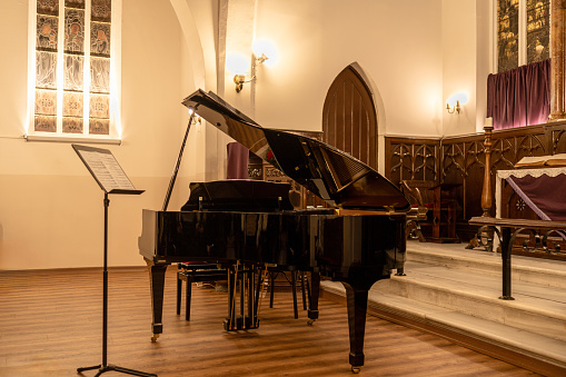 Classic grand piano inside a church