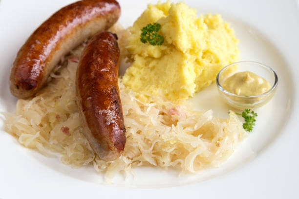 Roast sausages with sauerkraut and mashed potatoes