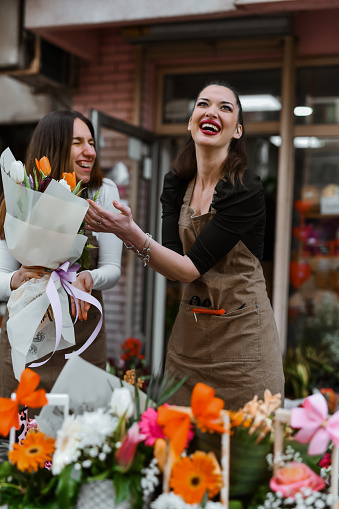 Smiling Female Florists Enjoying Making People Happy With Their Flowers On International Women's Day