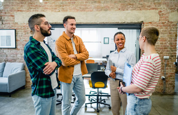 istock Colleagues having casual discussion in the office 2083919150