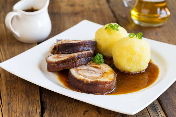 istock roast pork with dumplings and sauerkraut 2083950416