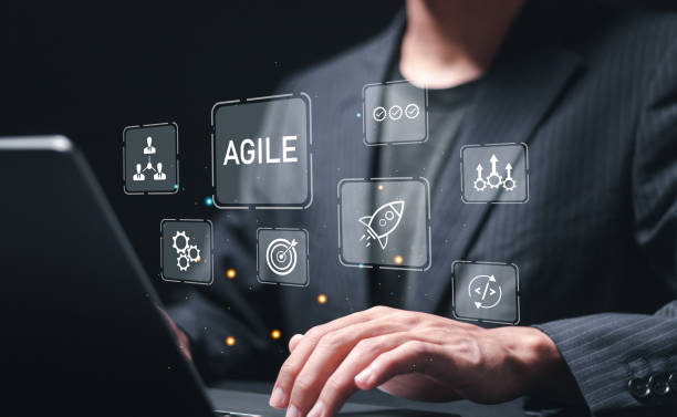 istock Agile development methodology, businessman use laptop with virtual screen of agile icons for process that will help you work faster By reducing step-by-step work and focusing on team communication. 2083956322