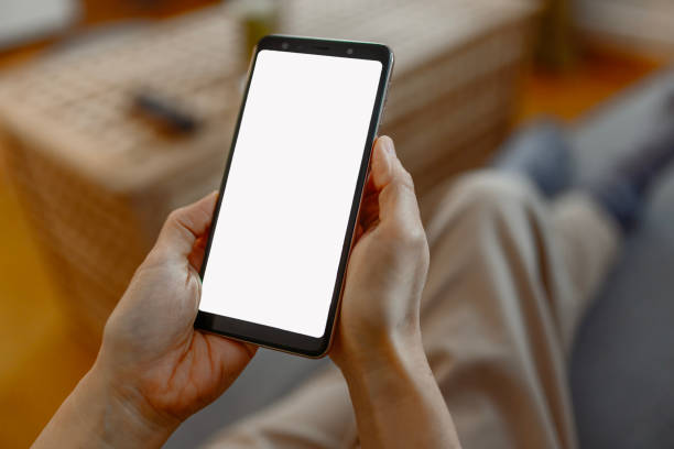 istock Mockup Image Blank White Screen Cell Phone in Woman Hands 2083962101