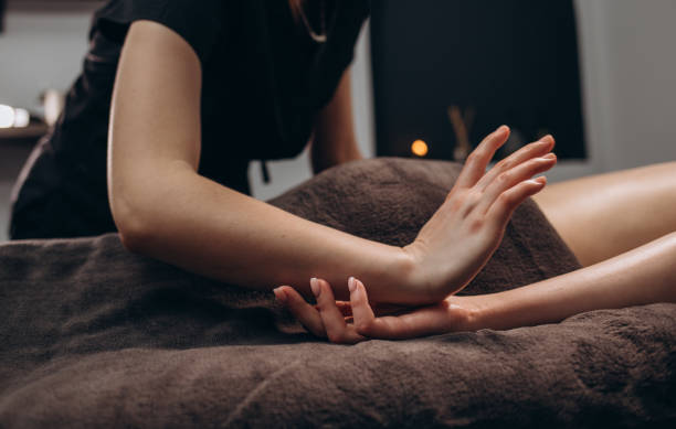 istock stroking massage of hands close up on a white background. 2084011453