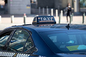 Close-up of taxi sign on car