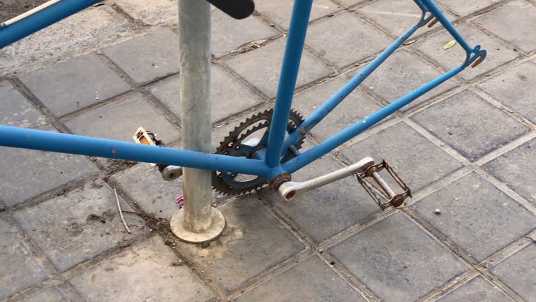 Bicycle in the street with missing wheels