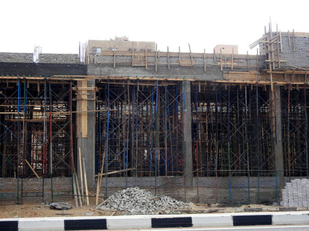 a new building that is still under construction in shinzo abe axis road in egypt, the traffic highway is named on former japanese pm - named logistics company photos et images de collection