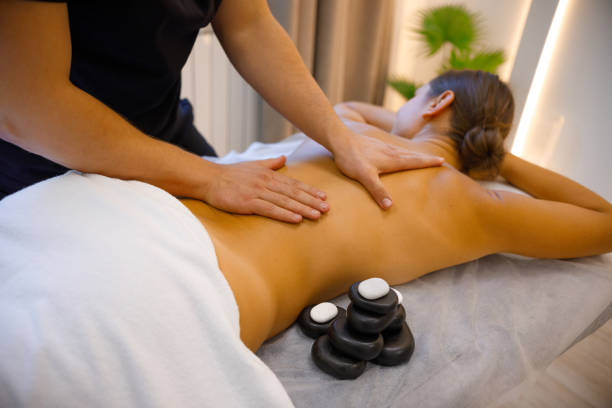 istock Muscle Rejuvenation: Skilled Masseuse Delivers Soothing Back Massage 2084101008