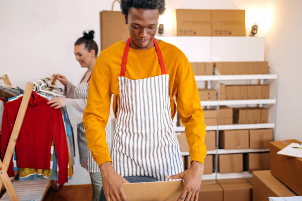 istock Young black man preparing package for delivery 2084105702