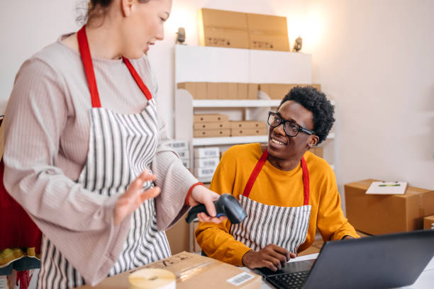 istock Young people working in packing and delivery service and using laptop to complete job 2084106754