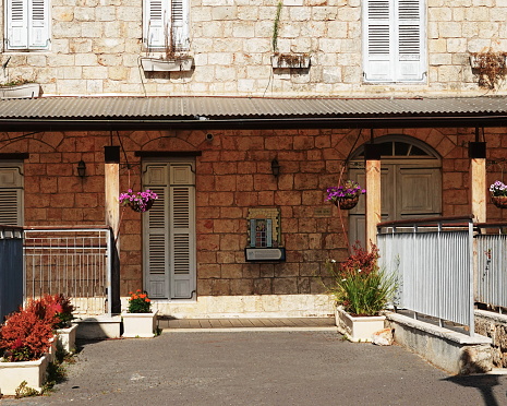 Traditional Stone House Facade with Flower Decorations