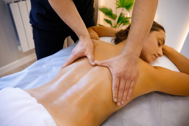 istock Pampering Moment: Woman Treated to Relaxing Back Massage 2084136716