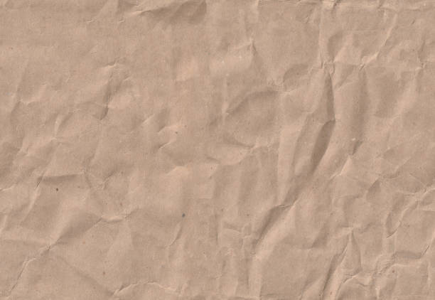 Seamless crumpled craft paper texture. Old scrapbook paperboard.