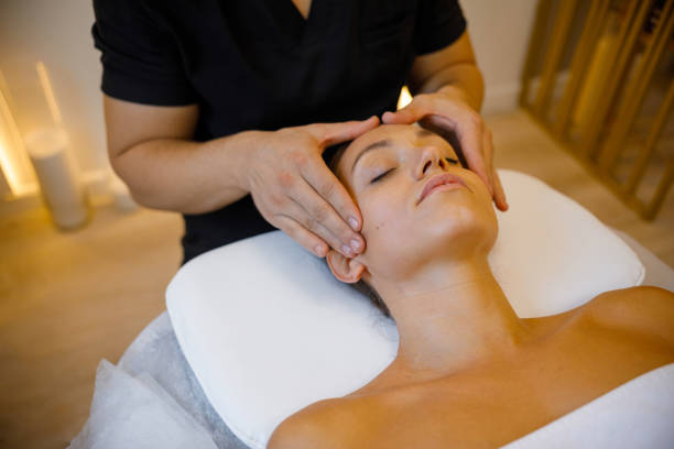 istock Wellness Retreat: Woman Enjoying Facial Massage 2084140355