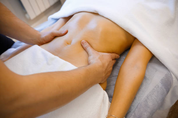 istock Renewal Ritual: Young Woman Enjoying a Stomach Massage 2084140878