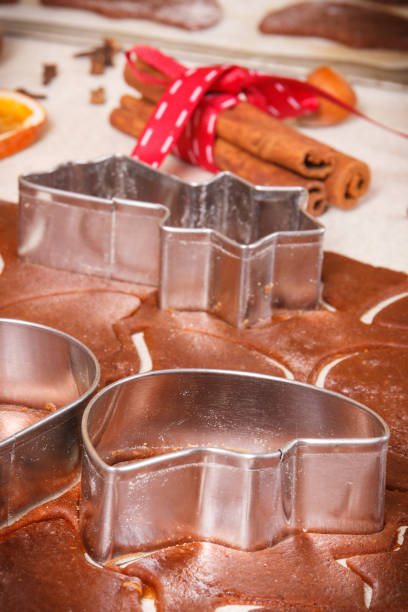 istock Dough and cookie cutters for baking cookies or gingerbread, festive Christmas time concept 2084146702