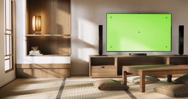 istock Smart Tv Mockup with blank green screen hanging in modern white empty room interior minimal designs. 2084147219