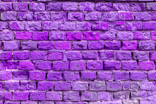 Brick wall of the building. Designer building background.