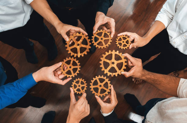 istock Business team joining cogwheel in circular together. Prudent 2084169733