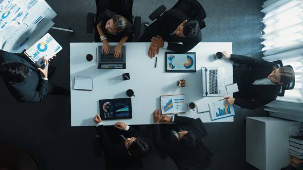 istock Top view of manager pointing at board while present marketing plan. Directorate. 2084190896