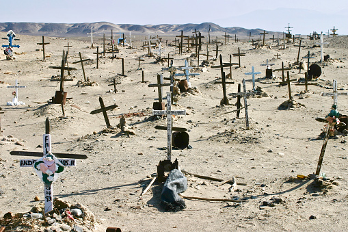 Nazca, Peru.  May 22nd 2006.  A cemetery in the desert on the outskirts of Nazca, Peru.