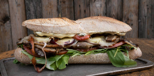 istock A gourmet meat sandwich with a wooden background 2084235343