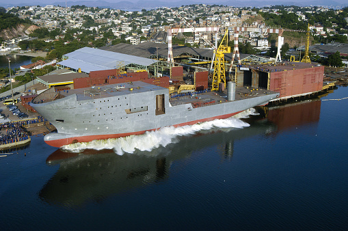 Drone perspective of the industrial ships on the Danube river.