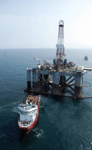 istock PSV platform supply ship and oil drilling platform. 2084239587
