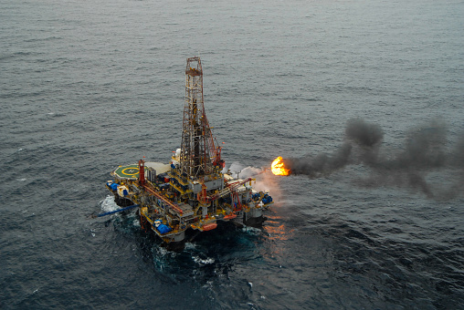 Offshore burner boom in oil drilling rig, Campos Basin, Brazil.