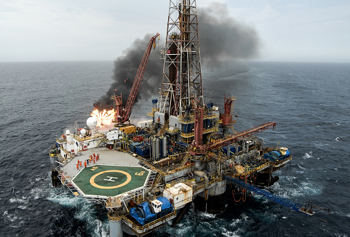 Offshore burner boom in oil drilling rig, Campos Basin, Brazil.