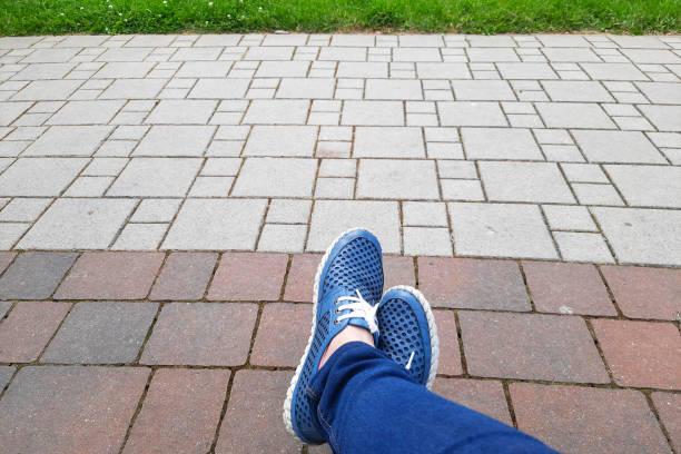 Selfie from personal perspective. Crossed legs of a resting person. Pause, rest, break. Vacation, active lifestyle concept.