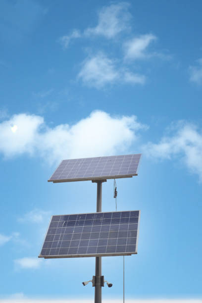 Solar pannels at street against blue sky .