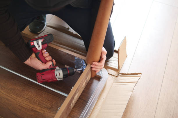 istock using electric drilling on wooden board 2084289339