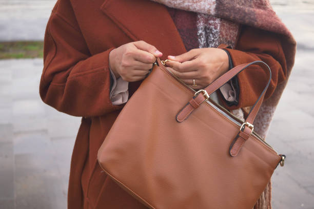 istock women Unzipping her purse close up 2084292497