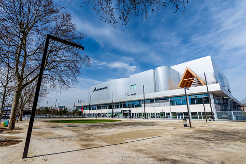 Paris, France - March 14, 2024: Exterior view of the Adidas Arena, also known as Arena Porte de la Chapelle, a multipurpose hall hosting sporting events and concerts, and an olympic venue